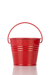 Red bucket with clean water isolated on white background.