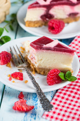 Raspberry cake with fresh fruits on rustic table