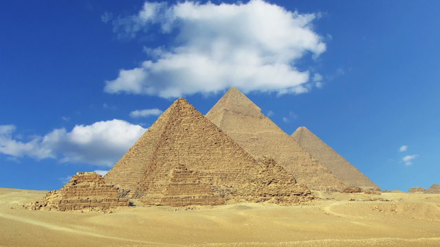Clouds over great pyramids at Giza Cairo in Egypt - zoom in time
