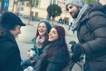 Friends Drinking Hot Beverage Outdoors