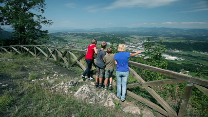 Group of people enjoying the landscape view from hill