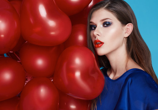 Beautiful sexy brunette woman makeup Valentines day balloons