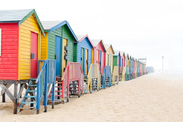 Naklejka premium Multi-colored beach huts at Muizenberg