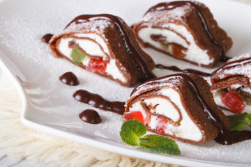 chocolate pancakes with cheese, fruit and mint horizontal