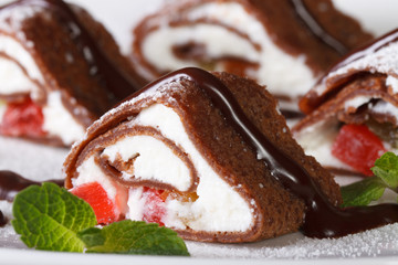 Delicious dessert: chocolate crepes with cheese macro.