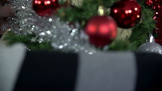 Silver ribbon Christmas decoration in close up slow motion