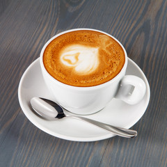 Cup of cappuccino coffee with heart