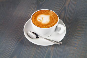 Cup of cappuccino coffee with heart