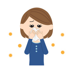 A young woman blowing nose, allergen flowing in the air