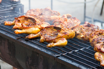 Chicken grilled over a charcoal fire
