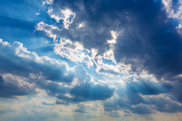 Fototapeta na wymiar Dramatic cloudy sky clouds with real sun beams