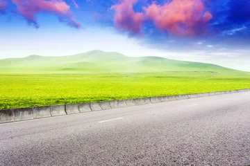  Road through meadow with cloud and sky background © zhu difeng