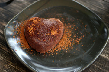 Chocolate cake on black plate
