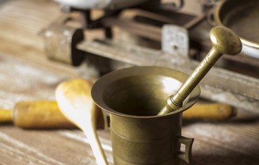 Mortar with kitchen tools. Shallow depth of field