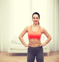 Fototapeta na wymiar smiling teenage girl in sportswear