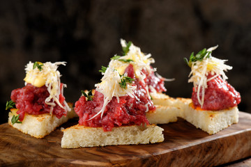 Spanish food tapas. Toasted bread with meat and vegetables