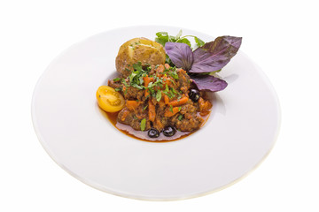  WILD BOAR STEWED IN A POT WITH VEGETABLES AND BAKED POTATO
