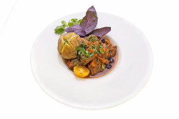  WILD BOAR STEWED IN A POT WITH VEGETABLES AND BAKED POTATO