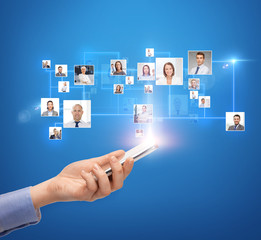 woman hand with smartphone over icons of contacts