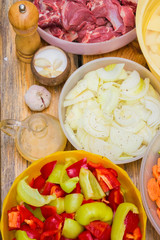 Products for barbecue, cut into pieces: meat, onion, garlic, pep