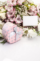 heart shaped gift and bouquet