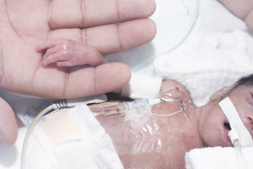 Fototapeta na wymiar Newborn and hand