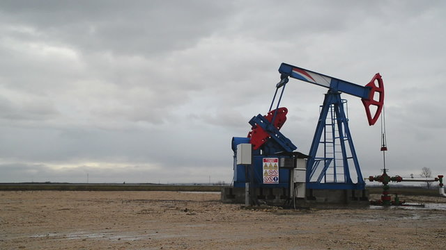 Pumpjack Oil Pump operating on natural gas in the oil field