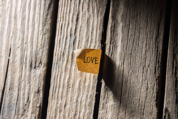 inscription love, wooden background