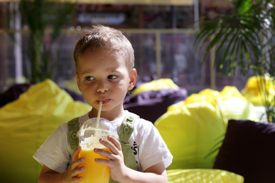 Boy drinking fresh juice
