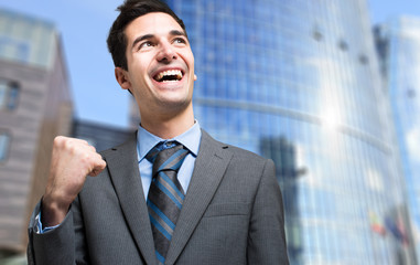 Fototapeta premium Successful businessman raising his fist
