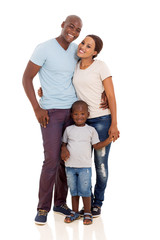 young african couple standing with their son