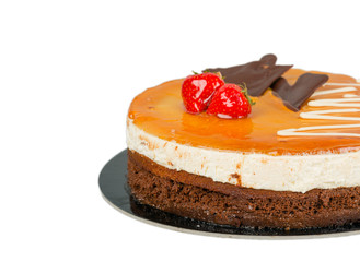 Chocolate cake with caramel on top isolated