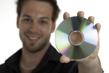 A 30 years old men holding a cd or a dvd