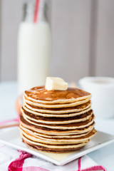 Pancake with butter, honey and milk, sweet breakfast