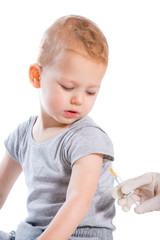 The doctor makes a baby vaccination on a white background.