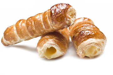 Italian cannoli filled with egg custard on white background