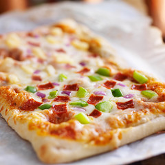 homemade baked pizza on parchment paper