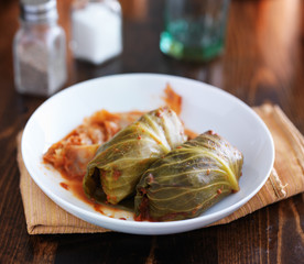cabbage rolls on plate on top of table