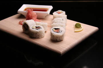 tasty sushi on black background
