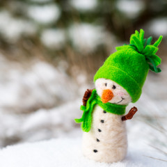 happy, smiling, cheerful snowman on snow