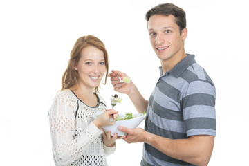 Happy mature couple having fun while cooking, Studio Shot