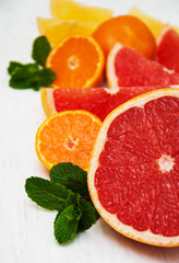 Fototapeta na wymiar Fresh citrus fruits with green mint