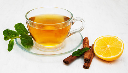 Cup of tea with lemon and mint