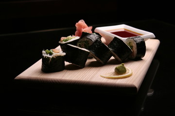 traditional sushi on black background
