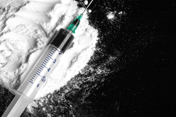 Cocaine drugs heap with syringe
