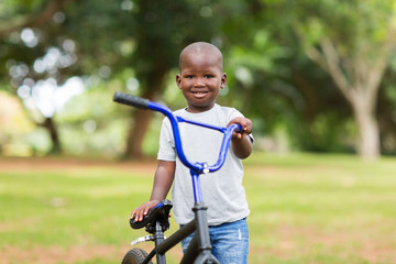 african little boy with his bicycle