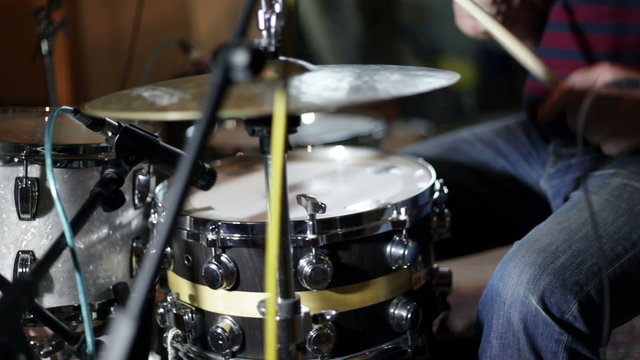 close up shot of musican playing drums