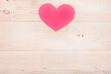 Heart from paper. Valentines day. Wooden background