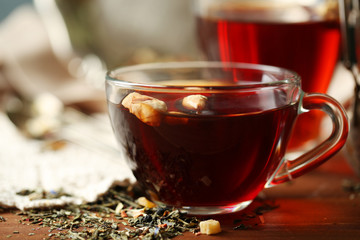 Beautiful vintage composition with herbal tea, on wooden table