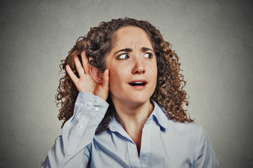 surprised nosy woman eavesdropping isolated grey background
